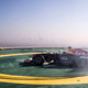 Illustration for article titled Red Bull F1 Did Donuts On Top Of The 689-Foot Burj Al Arab Helipad